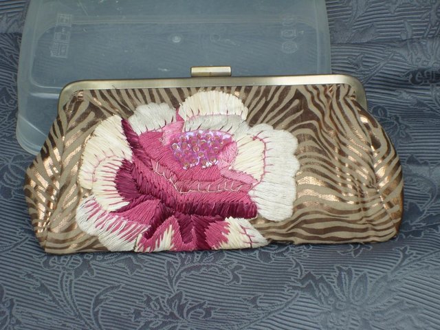 Preview of the first image of ACCESSORIZE Gold/Pink Flower Clutch Bag – NEW!.