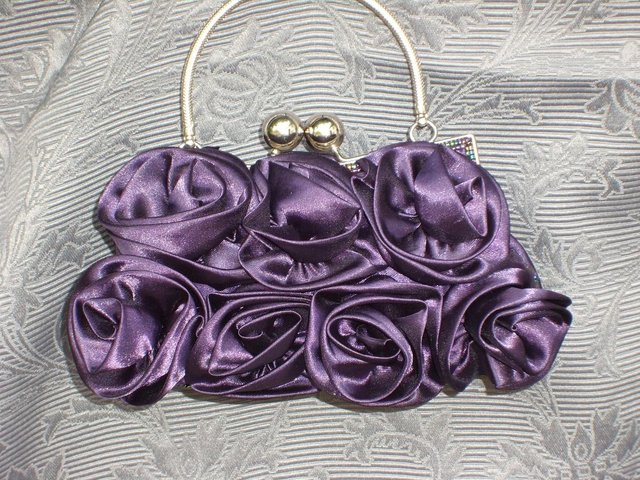 Preview of the first image of NEW LOOK Purple Satin Flower Handbag NEW!.