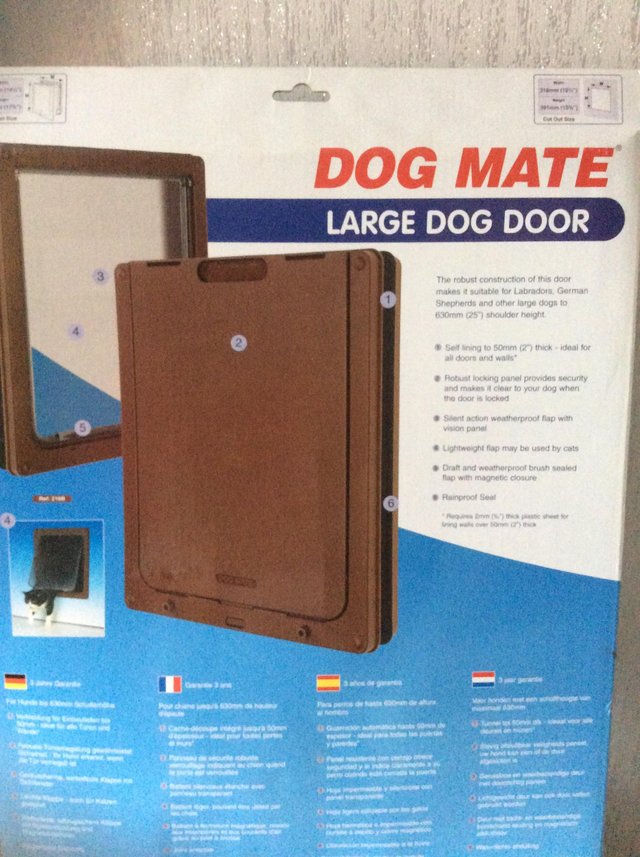 Preview of the first image of For Sale (. New still inbox) Dog Door Mate.