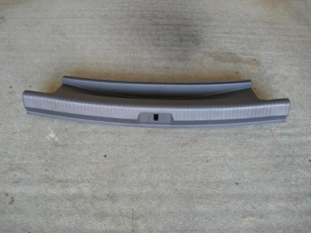 Preview of the first image of MK7 VOLKSWAGEN GOLF GENUINE REAR BOOT LATCH COVER.