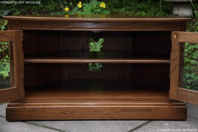 Image 55 of AN ERCOL GOLDEN DAWN CORNER TV DVD HI FI CABINET STAND TABLE