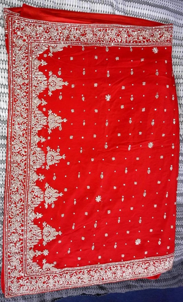 Preview of the first image of Indian wedding saree bright red.