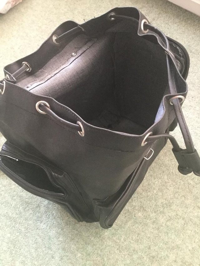 Preview of the first image of Large black handbag rucksack style.