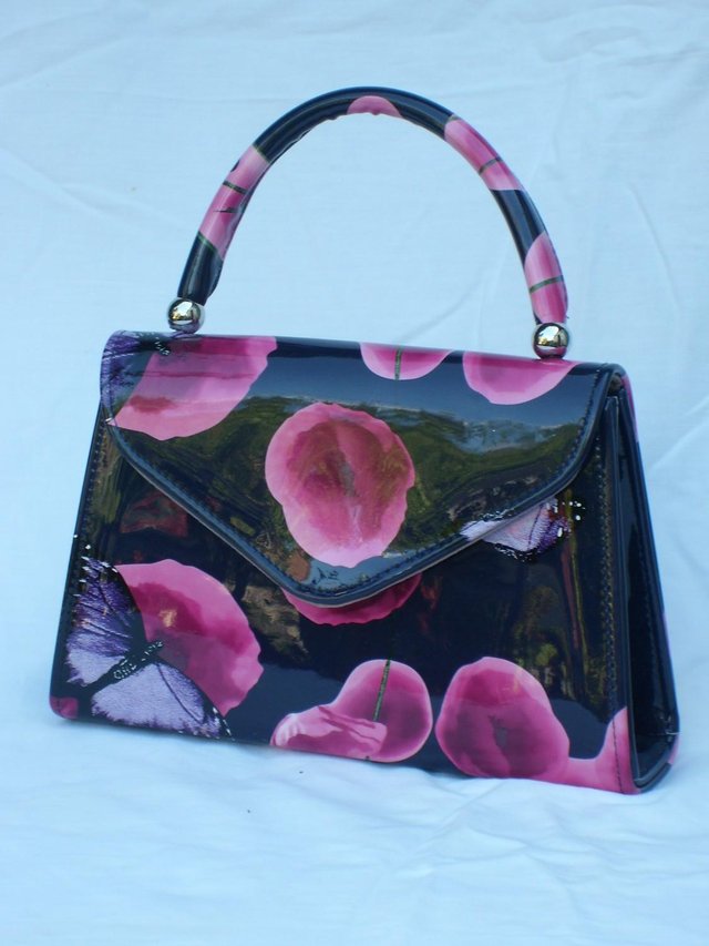 Preview of the first image of Purple/Pink Flower & Butterfly Patent Grab Bag.