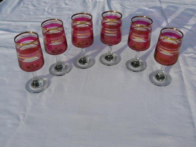 Preview of the first image of 6 Cranberry/clear liqueur glasses Gold tone bands c1930s.