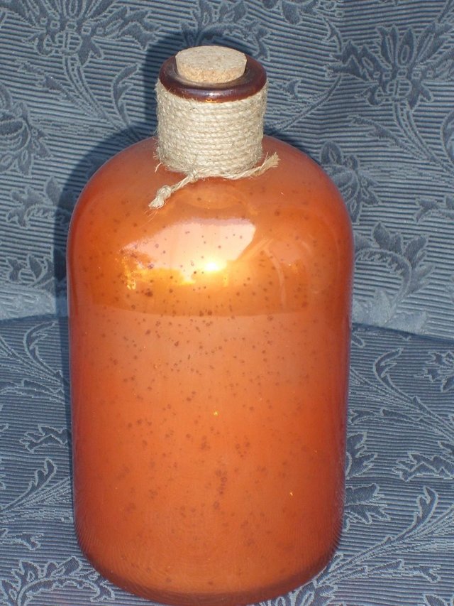 Preview of the first image of Decorative Orange Glass Bottle.