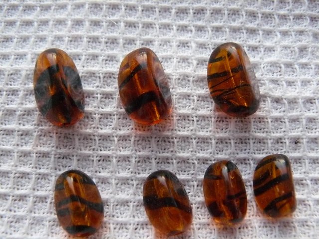 Image 2 of 15 antique amber/black stripe glass tiger beads Mixed sizes