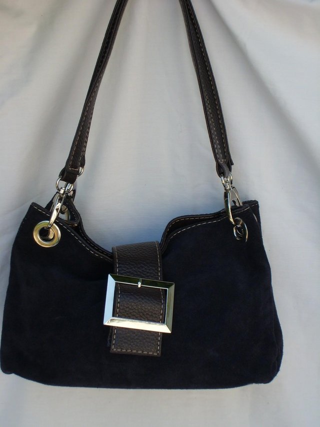 Preview of the first image of Black Suede Shoulder Bag With Brown Detail.