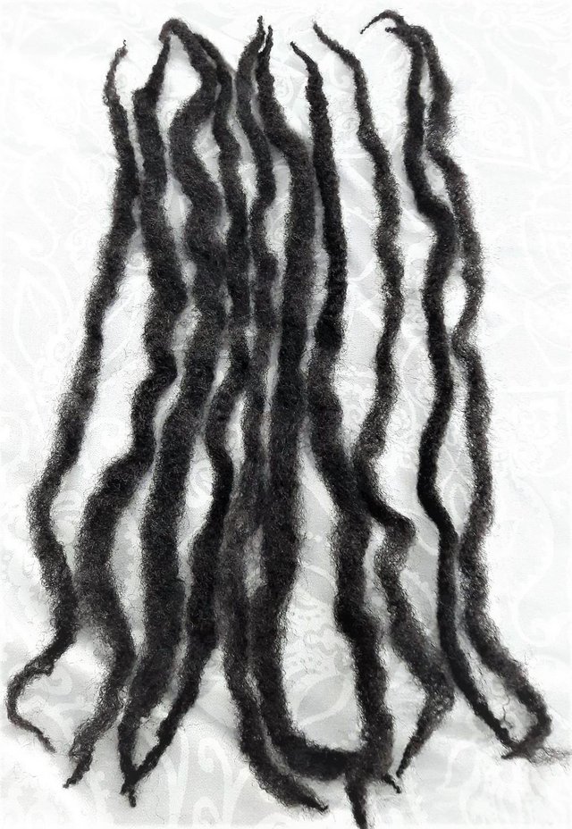 Preview of the first image of 10 long black hair pieces used to add volume to styles.
