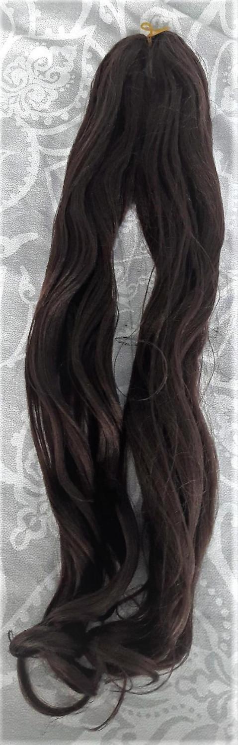 Preview of the first image of Long dark brown/black wavy hair extensions.