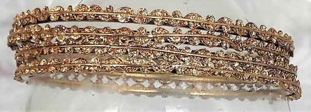 Preview of the first image of Indian glittery gold bangles x 4.