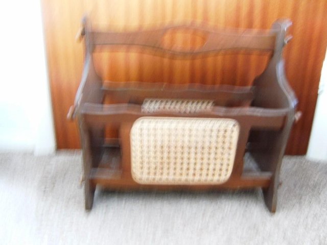 Preview of the first image of Vintage wooden magazine rack with classic cane weave.