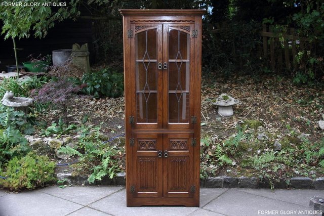 Preview of the first image of OLD CHARM LIGHT OAK CORNER DISPLAY CABINET CUPBOARD STAND.