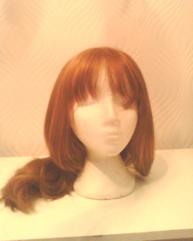 Preview of the first image of ADJUSTABLE  STRAP  SYNTHETIC WIGS.