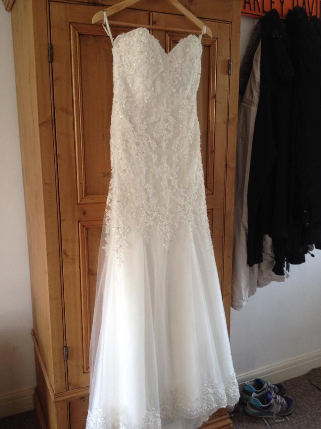 Preview of the first image of PRELOVED IVORY MORI-LEE FISHTAIL WEDDING DRESS.