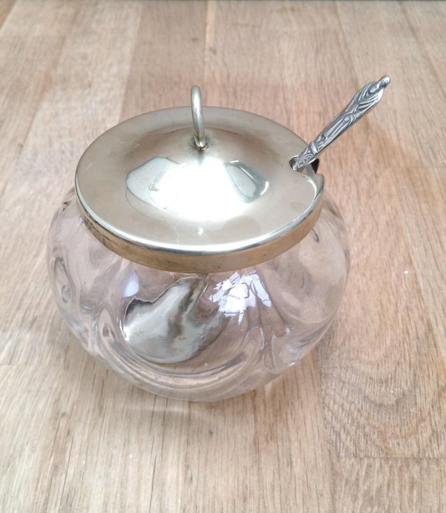 Preview of the first image of Antique glass condiment jar silver plated top.