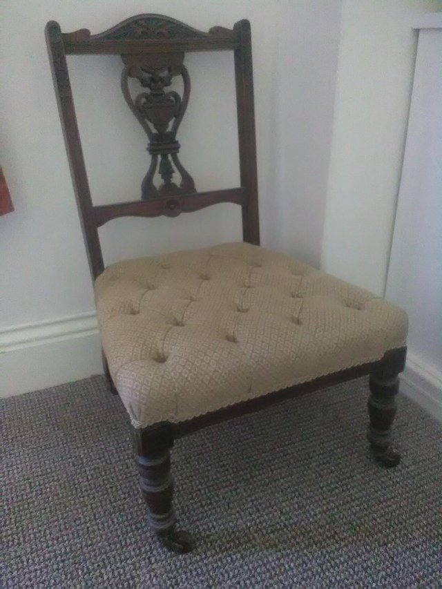 Preview of the first image of ANTIQUE NURSING CHAIR.