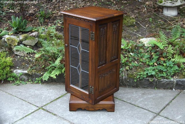 Preview of the first image of OLD CHARM LIGHT OAK REVOLVING CD STORAGE DISPLAY CABINET.