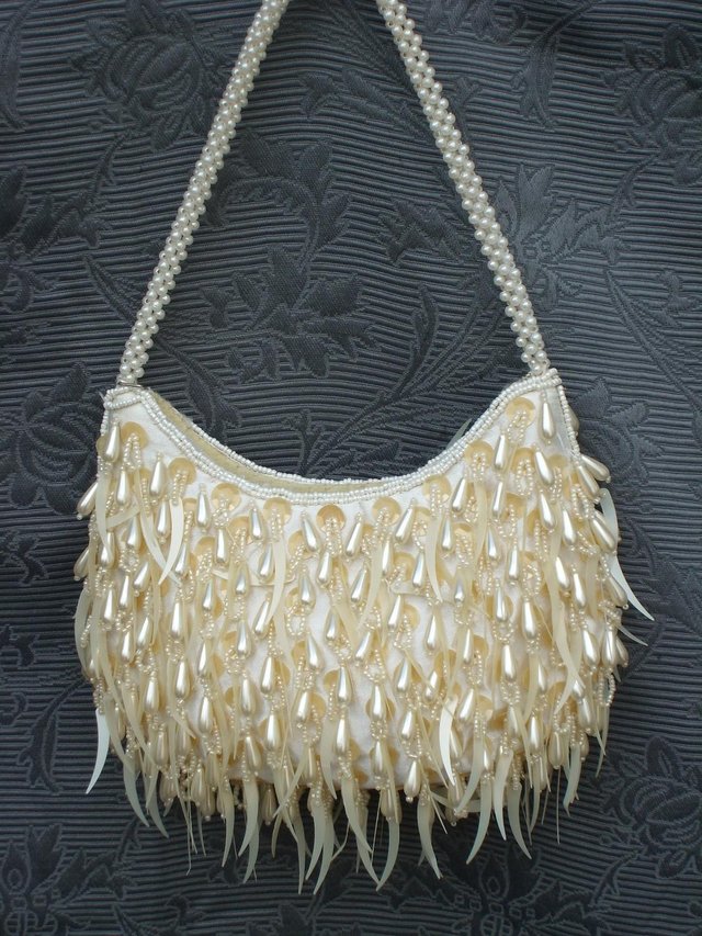 Preview of the first image of Cream Satin Pearl Drop Handbag NEW.