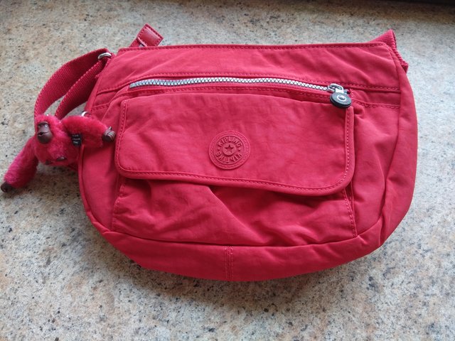 Preview of the first image of Cherry red Kipling shoulder bag.