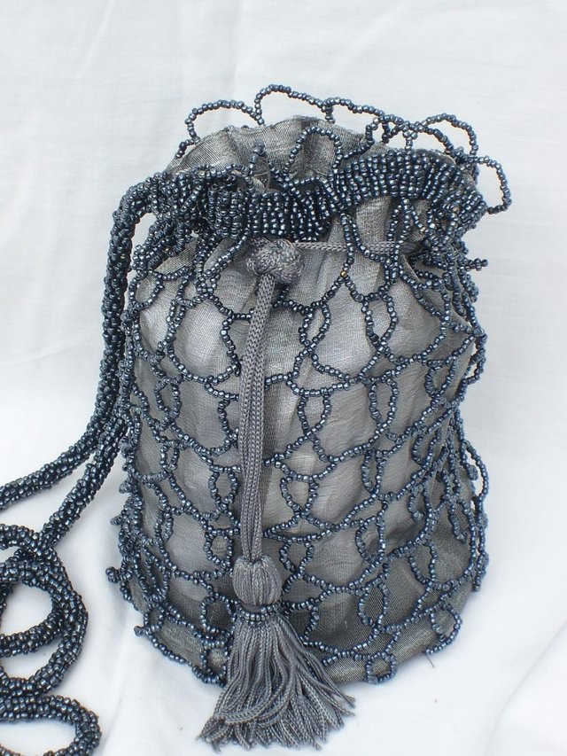 Preview of the first image of Silver/Grey Beaded Drawstring Bag NEW.