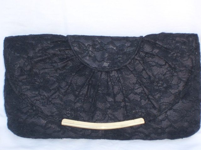 Preview of the first image of DORETHY PERKINS Black Lace Clutch Bag.