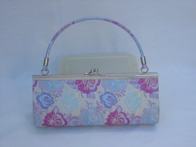 Preview of the first image of Blue/Pink Flowery Snap Top Bag.