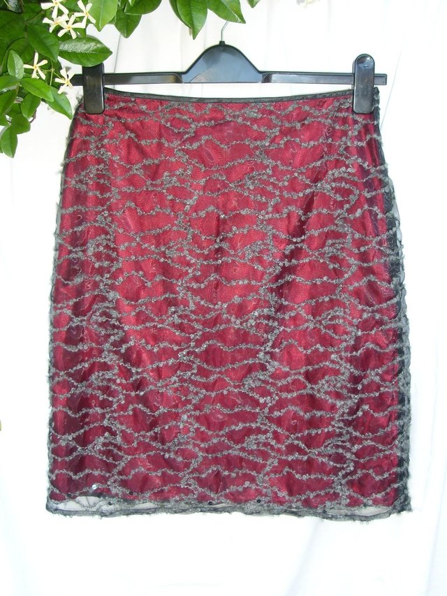 Preview of the first image of KEIN YUKI Red Mini Skirt – Size 8.