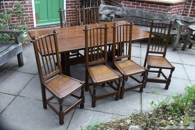 Preview of the first image of A NIGEL RUPERT GRIFFITHS OAK DINING SET TABLE & SIX CHAIRS.