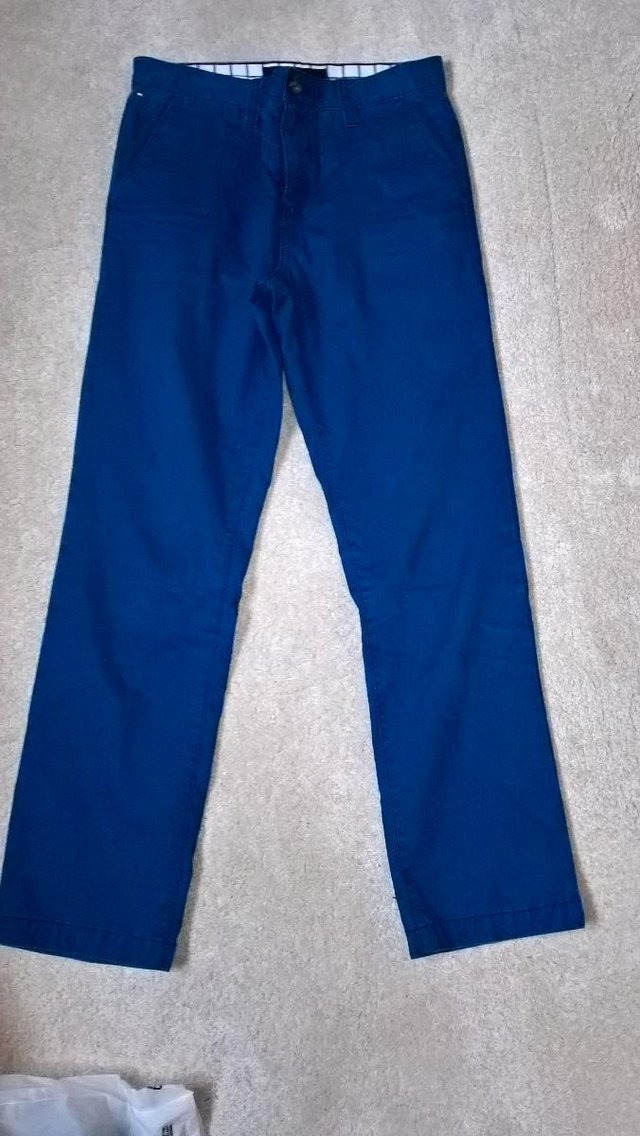 Preview of the first image of Tommy Hilfiger blue Chino Trousers age 15-16 years.
