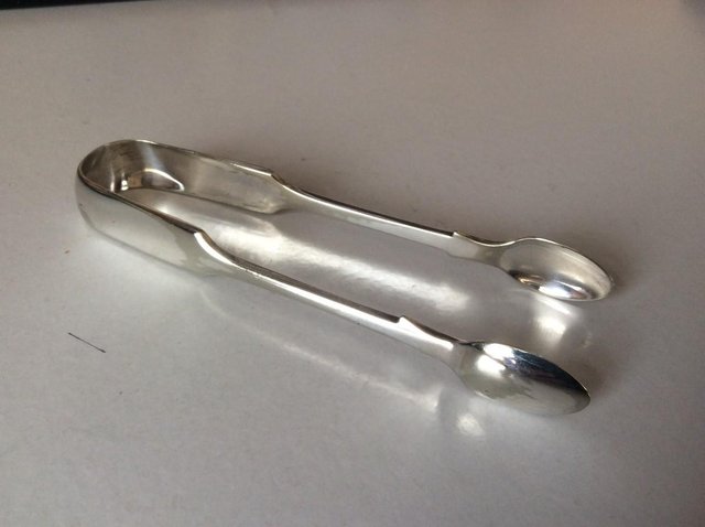 Preview of the first image of SILVER SUGAR TONGS.