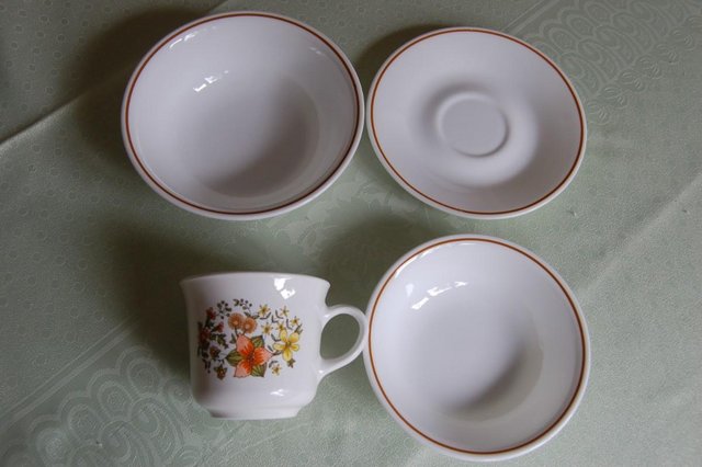 Preview of the first image of Corelle Floral Pattern Stoneware 6 Cups and 4 Saucers.