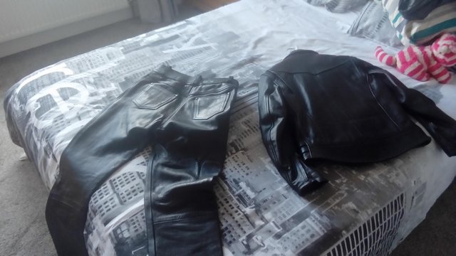 Preview of the first image of Ladies black leather motorbike suit.