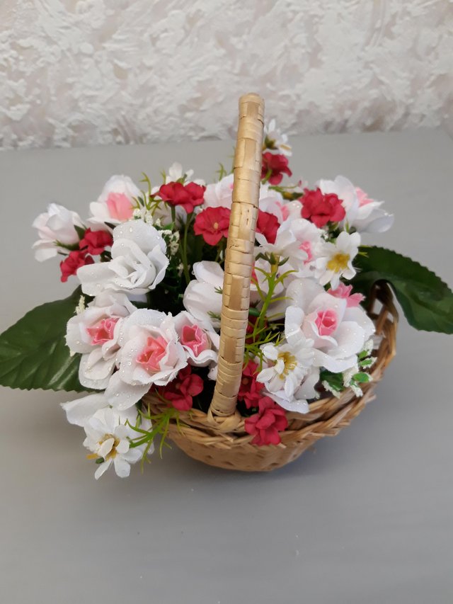 Preview of the first image of Floral basket arrangement.