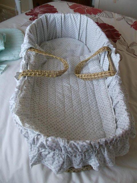 Preview of the first image of Baby's Moses basket with bedding.