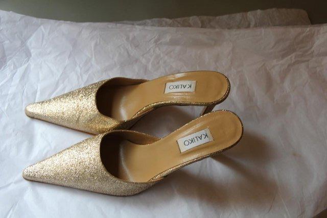 Preview of the first image of Kaliko Brand - Gold Sparkle Shoes – Size 5 / 38.