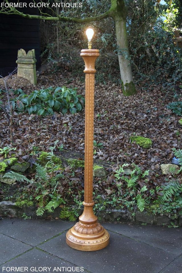 Preview of the first image of A NIGEL RUPERT GRIFFITHS MONASTIC CARVED OAK STANDARD LAMP.