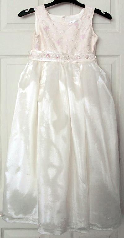 Preview of the first image of GORGEOUS GIRLS IVORY PARTY DRESS WITH BOW DETAIL AGE 7 YRS.