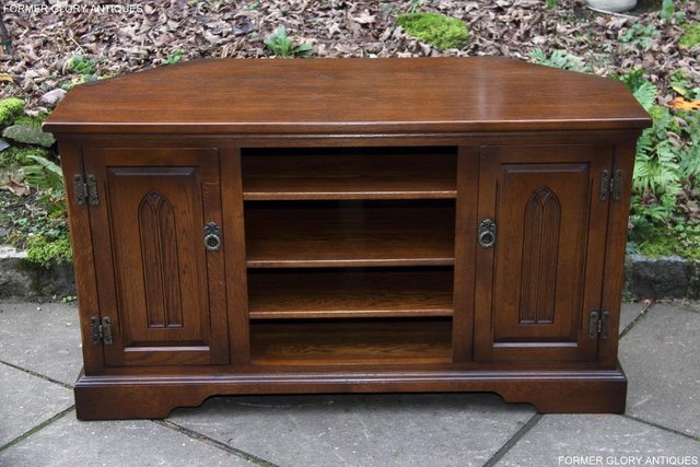Preview of the first image of OLD CHARM LIGHT OAK CORNER TV CABINET TABLE DVD STAND UNIT.