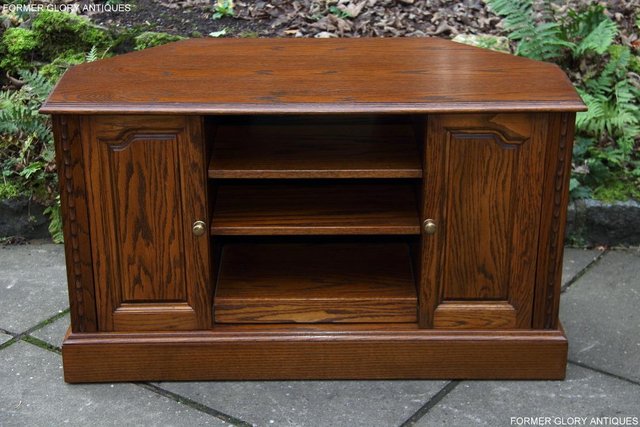 Preview of the first image of A JAYCEE OLD CHARM OAK CORNER TV TABLE HI FI DVD CD CABINET.