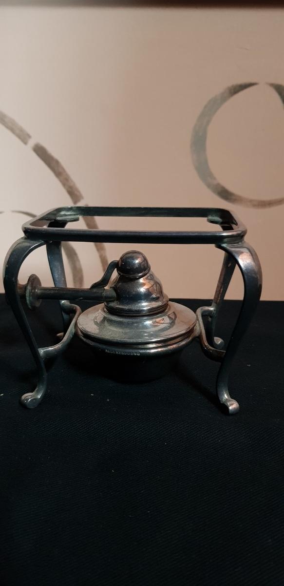 Preview of the first image of Old silver teapot warming stand.