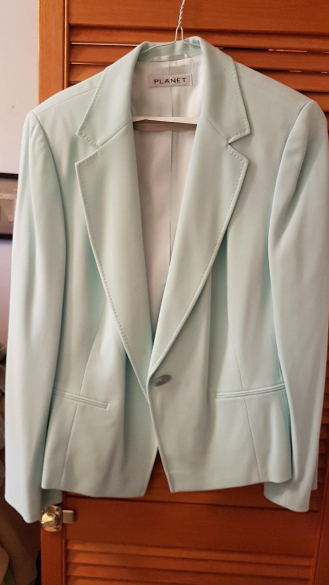 Preview of the first image of LADIES PLANET JACKET AND TROUSERS SIZE 16.