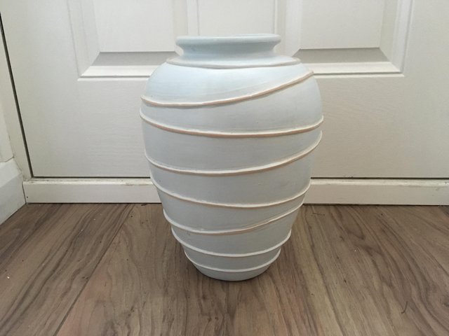 Preview of the first image of Pale blue pottery vase New. Still in original packaging.