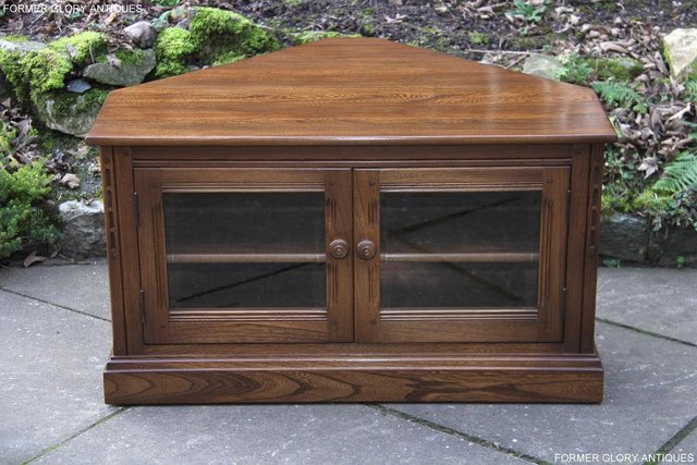 Preview of the first image of ERCOL GOLDEN DAWN ELM CORNER TV CABINET HI FI CD DVD STAND.