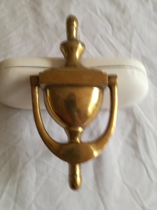 Preview of the first image of Grecian urn style door knocker.