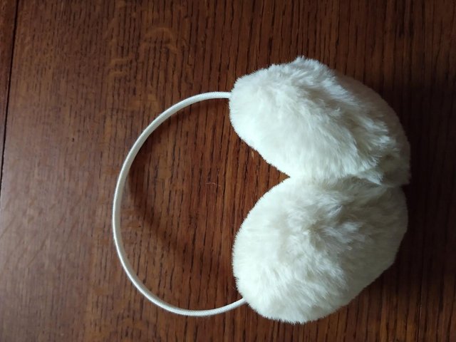 Preview of the first image of Cream Furry Ear muffs. NEW.