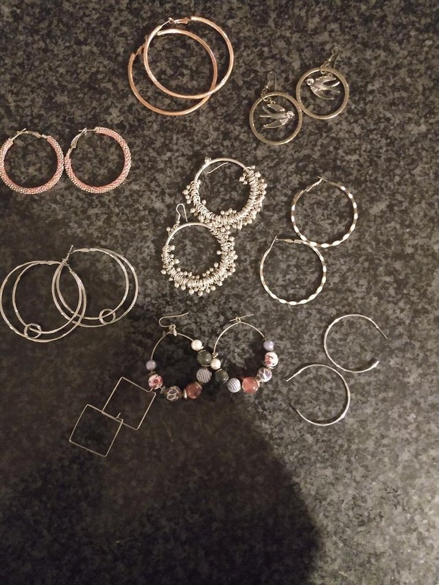 Preview of the first image of 9 pairs of hoop earrings.