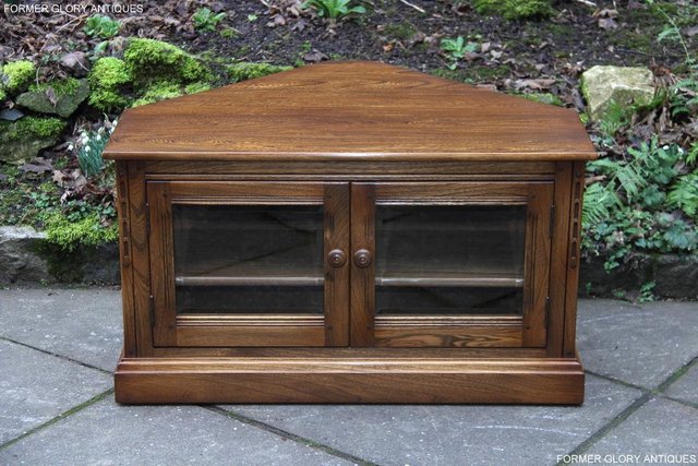Preview of the first image of ERCOL GOLDEN DAWN CORNER TV CABINET HI FI CD DVD STAND TABLE.