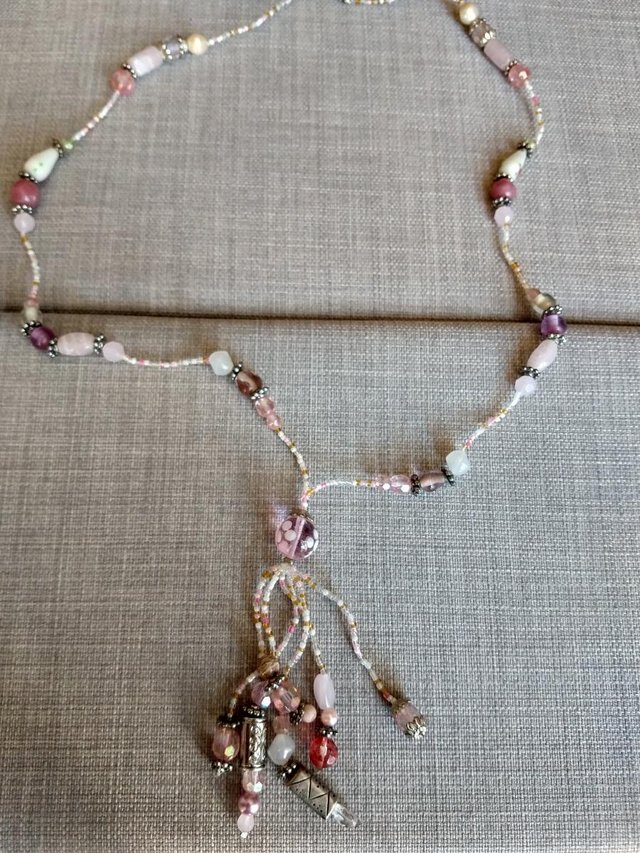 Preview of the first image of Long pink beaded necklace.