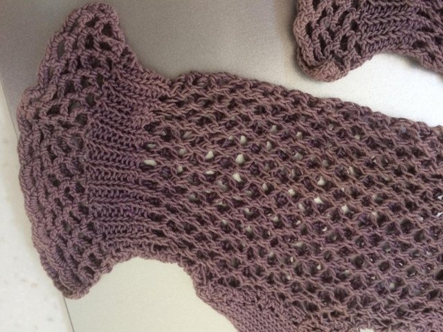 Preview of the first image of Pair of ladies mauve cotton vintage crochet gloves.